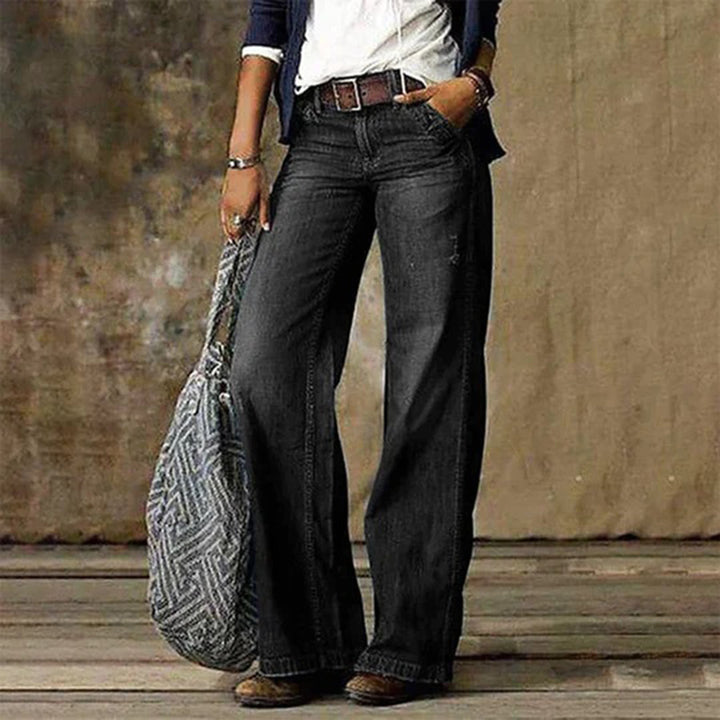 Full shot of women's fashionable high-waisted wide-leg denim jeans, ideal for comfortable wear.