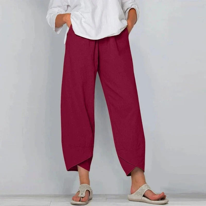 Trendy women's wide leg pants, high-waisted and relaxed, offering a versatile and fashionable look for any day.