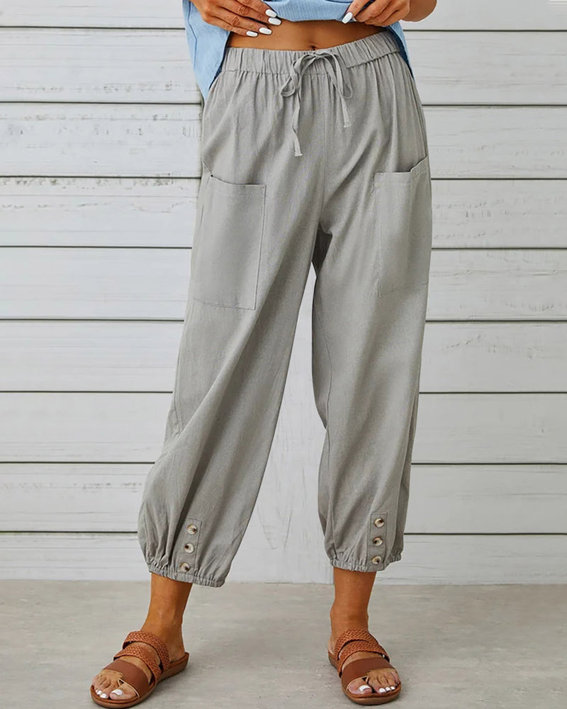 Comfortable women's high-waisted wide leg pants, offering a loose fit. Ideal for casual or office wear.