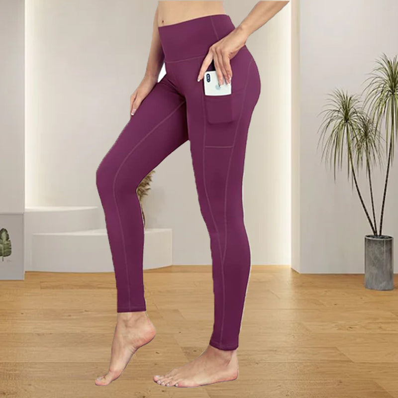 Women's performance yoga leggings with comfortable elastic high-rise waist and pockets.