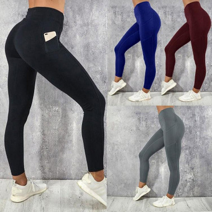 Model wearing women's high-waisted yoga leggings with smartphone in pocket during a workout.