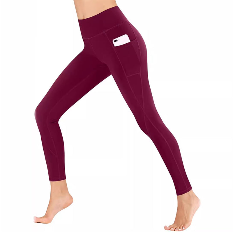 Side profile of a woman demonstrating the ease of access to pockets on her yoga leggings.