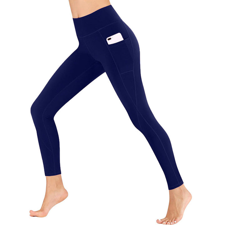 Women's fitness leggings with high-rise waist and spacious pockets, essential activewear.