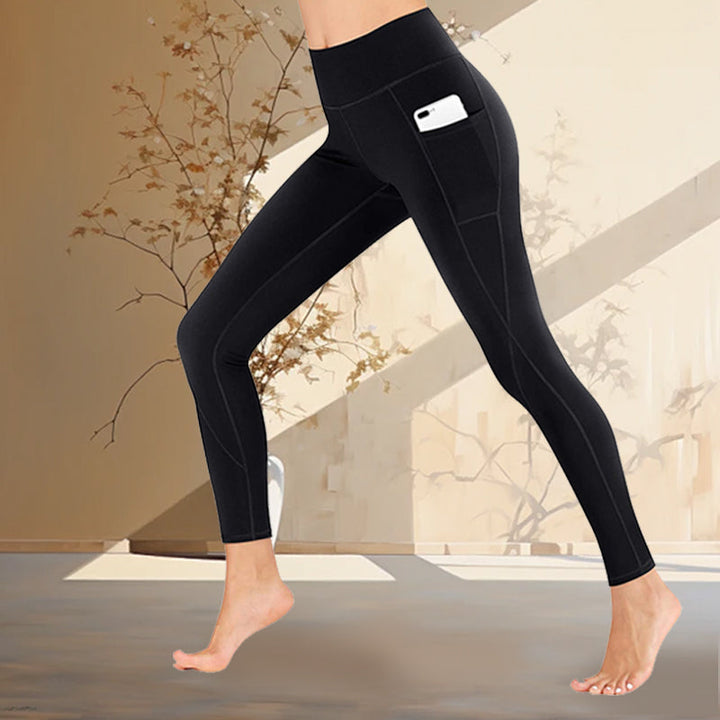 Athleisure women's leggings with high waist and pockets in a vibrant color, great for fitness.