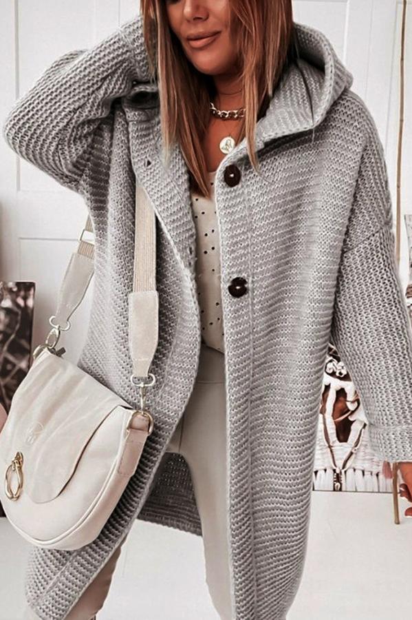 Modern women's hooded knit vest, featuring a button-up design for easy wear.