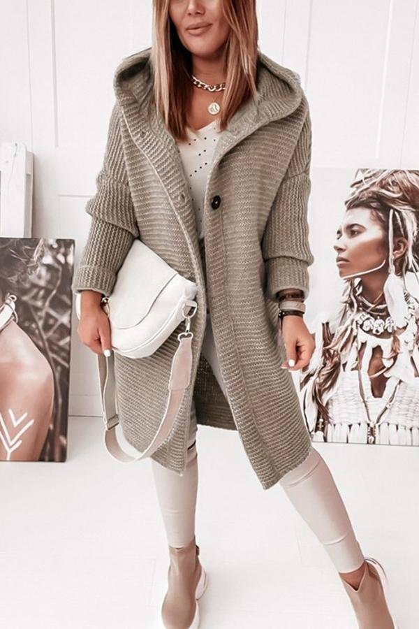 Comfy hooded knit vest for ladies, designed with a classic button closure.