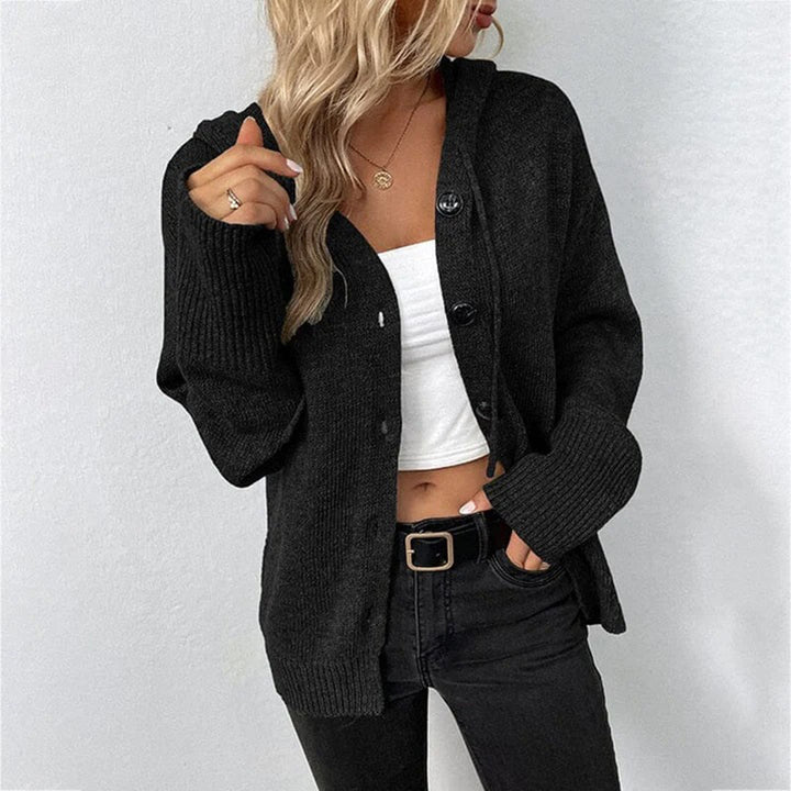 Close-up of a women's hooded knit open front cardigan, showing button details and fabric texture