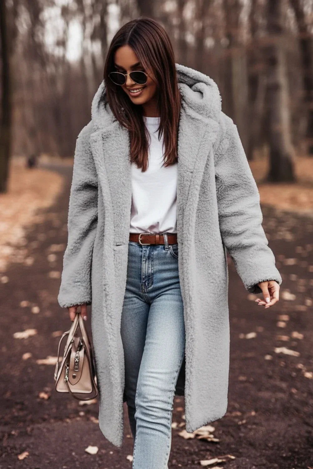 Casual women's hooded teddy coat. Oversized, plush winter jacket for cozy outerwear and chic cold-weather style.