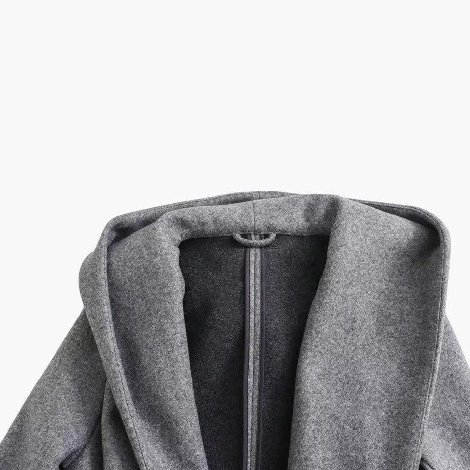 Ladies' long hooded trench coat with button-front closure. Ideal for casual outdoor style & all seasons.
