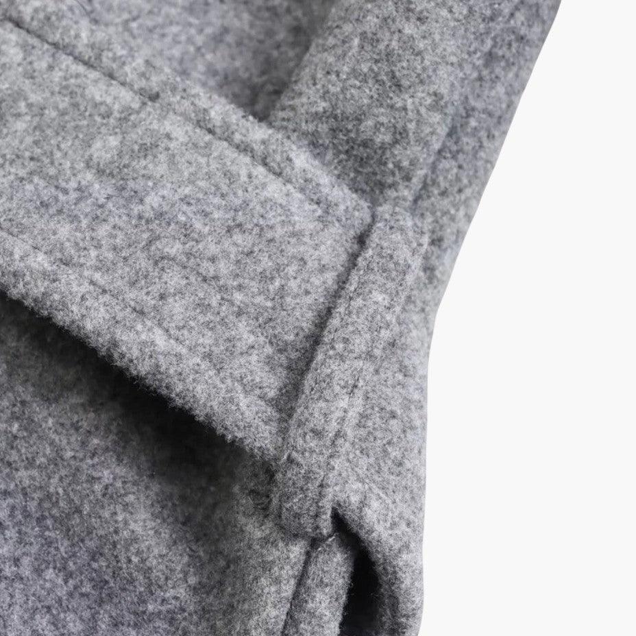 All-weather women's trench coat, hooded, with a chic belted waist & classic button front.