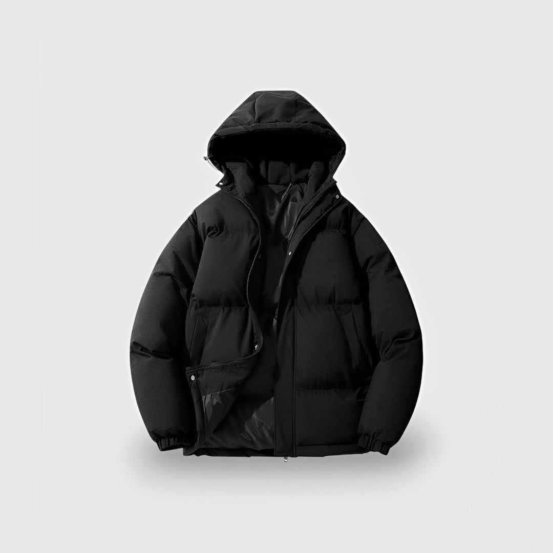 Female model wearing a cozy hooded winter puffer coat, ideal for cold climates