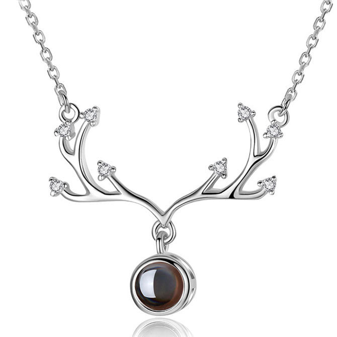 Rose gold heart necklace with 'I Love You' projection feature, a stunning anniversary gift.
