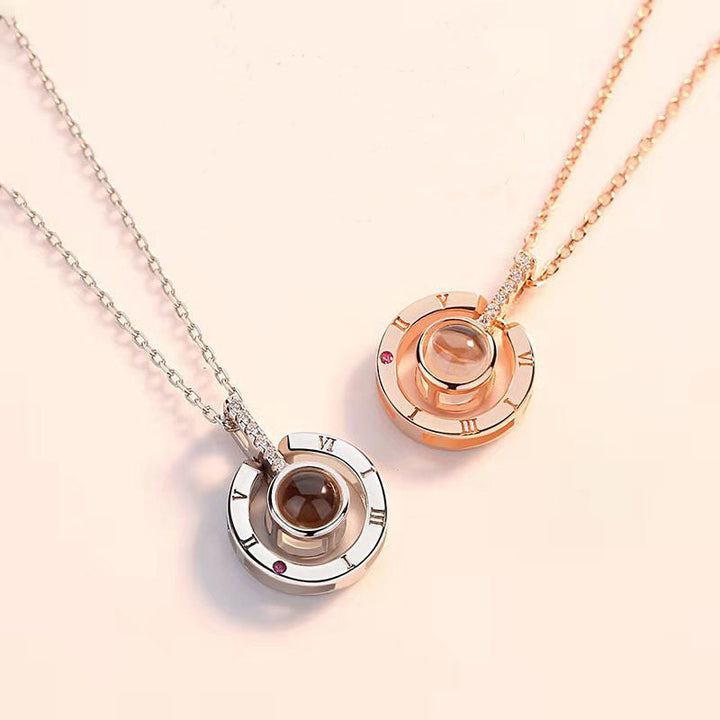 Women's stylish 'I Love You' projection necklace in rose gold, a blend of sentiment and fashion.
