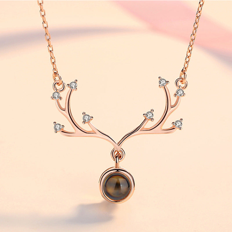 Women's romantic rose gold 'I Love You' projection necklace, perfect for expressing deep affection.