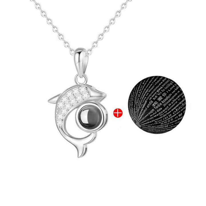 Projected 'I Love You' message in 100 languages from the rose gold heart necklace.