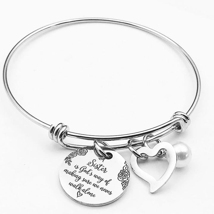 Detail view of the polished stainless steel and engraving on sister bangle jewelry