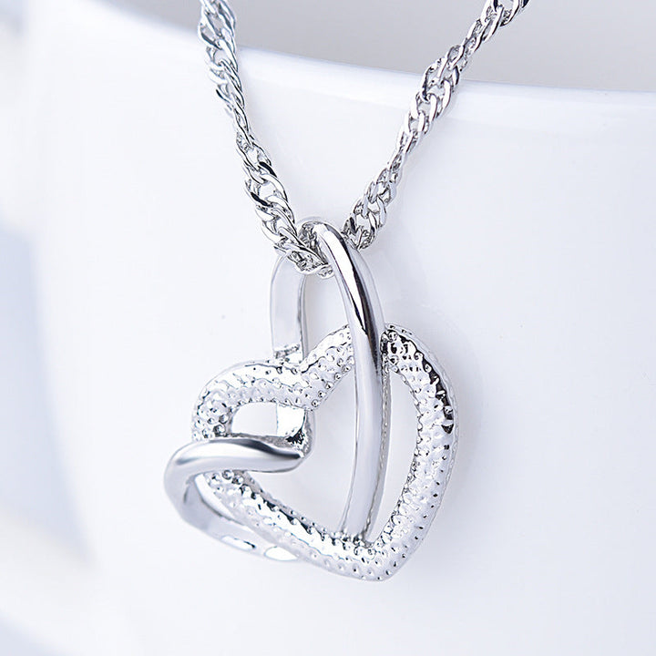 Heart jewelry for women, an adjustable interlocking design, celebrating family love.