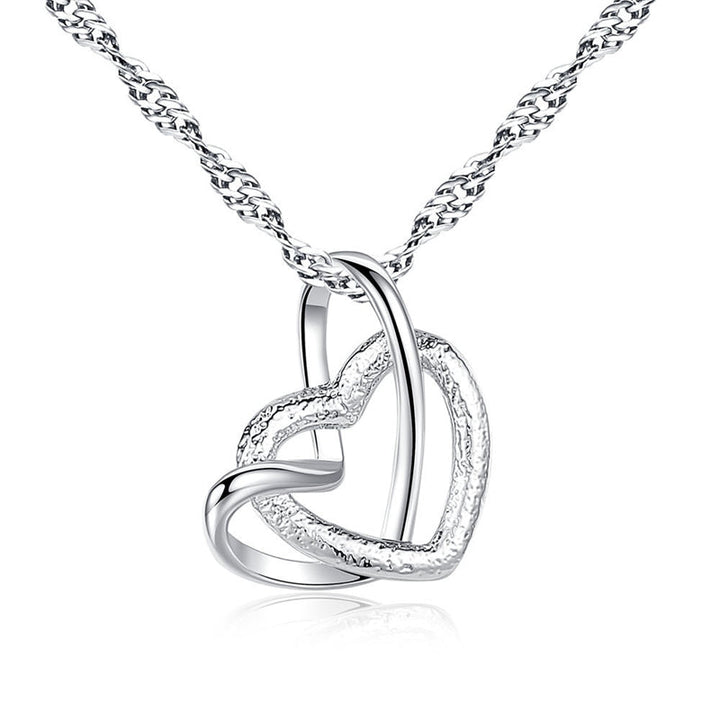Gift-ready interlocking heart necklace, a touching symbol for grandma & granddaughter.