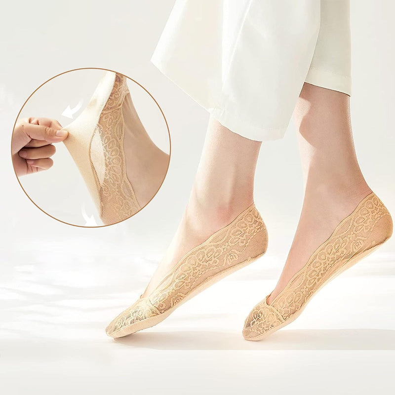 Women's no-show socks with delicate lace trim, ideal for a seamless look under shoes.
