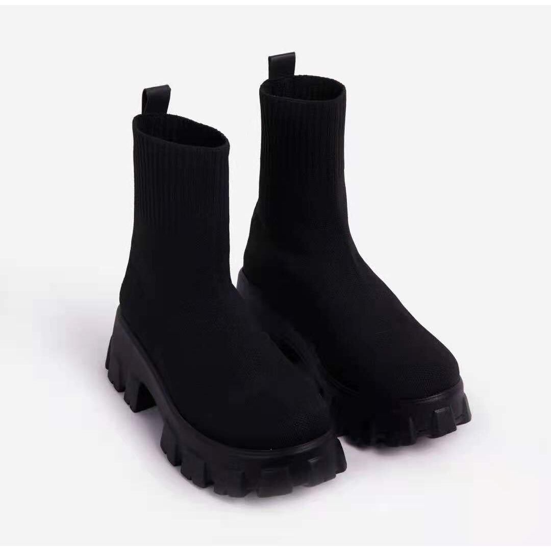 Black women's chunky platform ankle boots with strong grip, ideal urban footwear for winter.