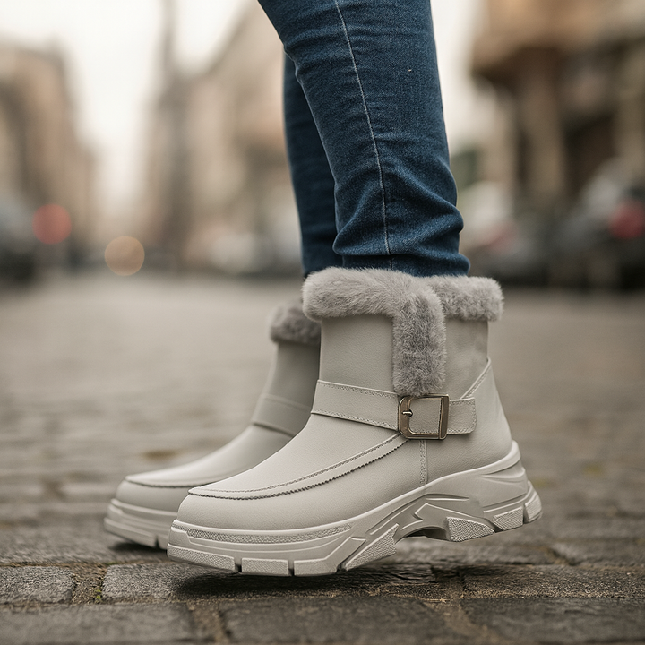 Close-up of faux fur lining in women's khaki winter boots with buckle detail