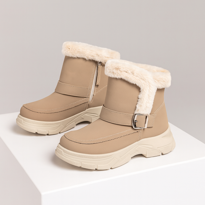 Side profile of women's khaki buckle boots, showing orthopedic sole and shock absorption
