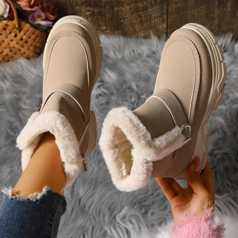 Detail of the buckle closure on women's faux fur lined gray winter boots