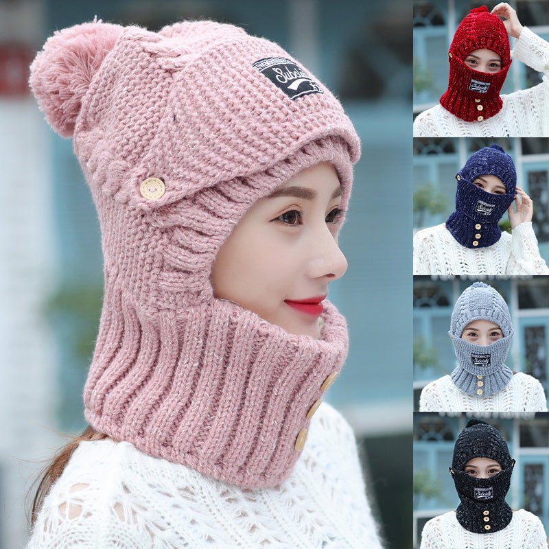 Women's knitted beanie in a vibrant color with ear protection, perfect for cold weather.