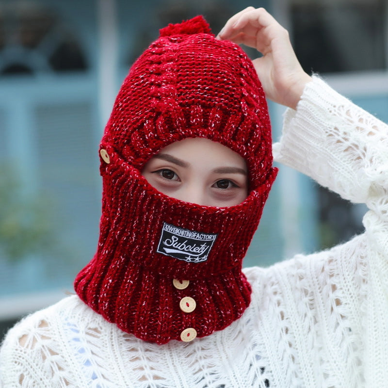 Woman wearing a comfortable knitted beanie hat, demonstrating its cozy ear protection.