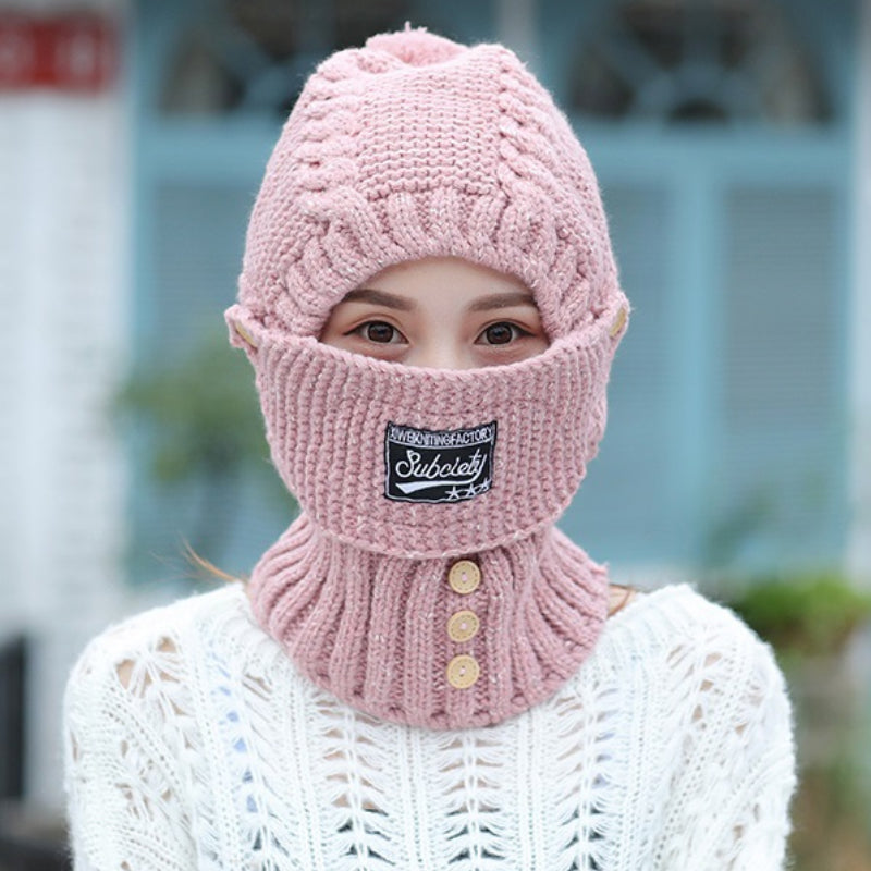 Knitted beanie for women, designed for cold weather, featuring ear flaps and a snug fit.