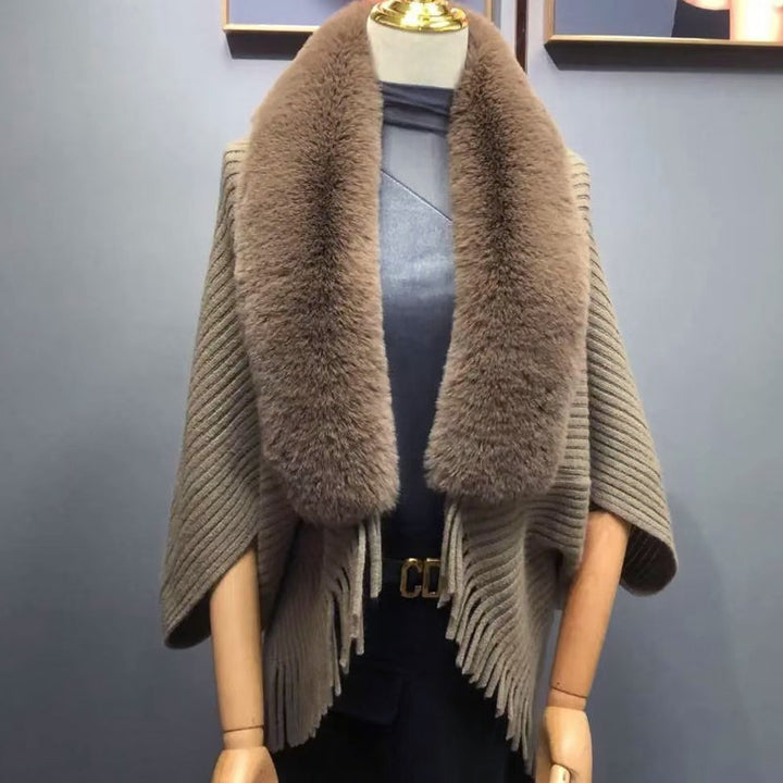 Elegant women's knitted wrap, thick and soft, ideal for layering during winter.