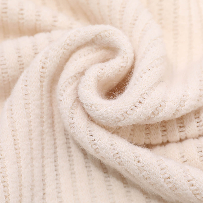 Fashionable women's knitted accessory, a cozy shawl with faux fur, perfect for winter outfits.
