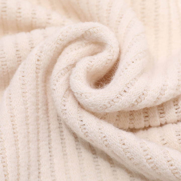 Fashionable women's knitted accessory, a cozy shawl with faux fur, perfect for winter outfits.