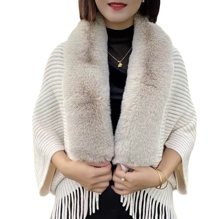 Knitted women's shawls in various colors, all featuring thick, loose knit and faux fur edges.