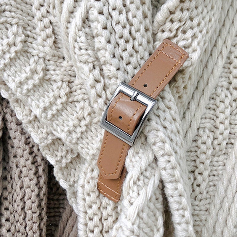 Brown knitted triangle shawl with a decorative buckle, autumn/winter essential