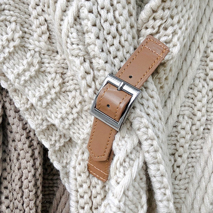 Brown knitted triangle shawl with a decorative buckle, autumn/winter essential