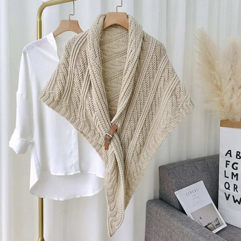 Women's oversized triangle poncho shawl, knitted, demonstrating its generous size