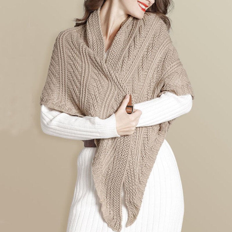 Back view of a woman wearing a large knitted triangle shawl, versatile style