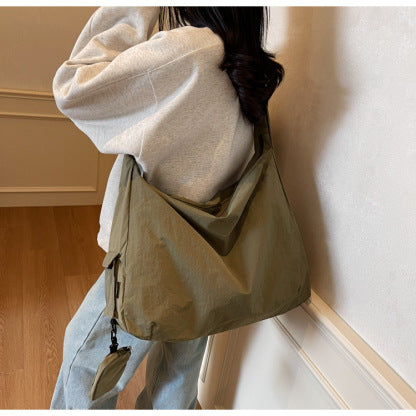 Practical women's crossbody travel bag, ample space for all essentials.