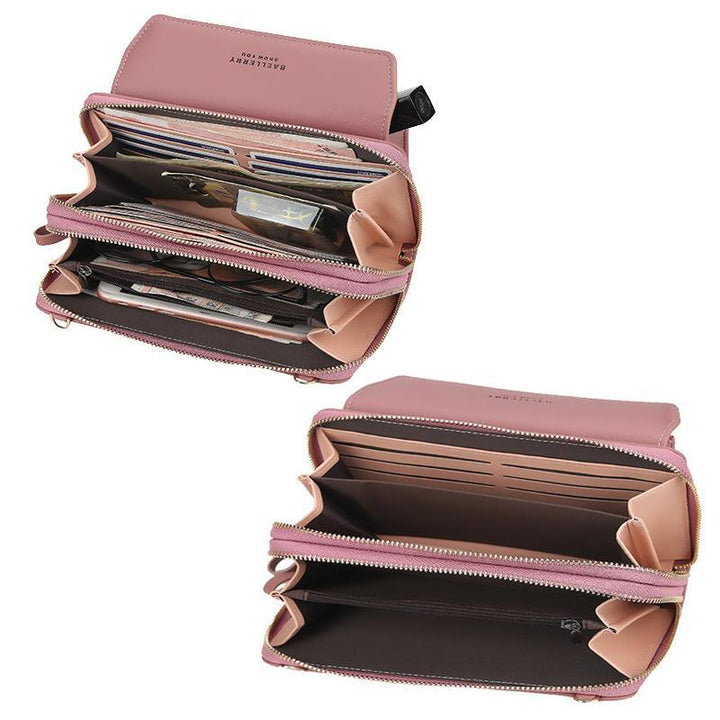 Detailed shot of the interior of a large capacity women's phone bag, showing multiple compartments