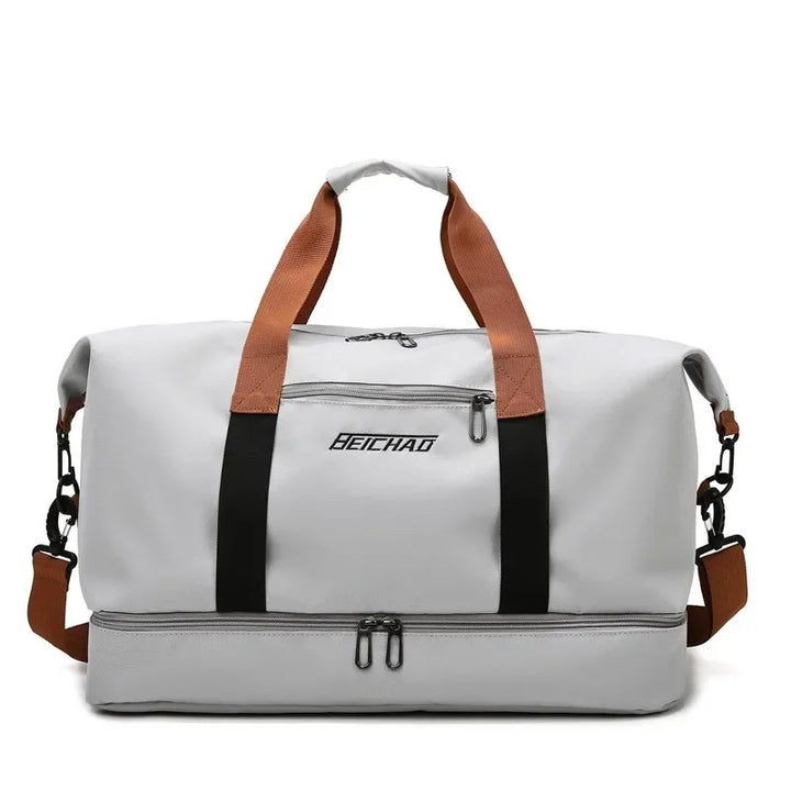 Durable women's large gym & travel bag with wet-dry pockets & shoe compartment for organized fitness gear.