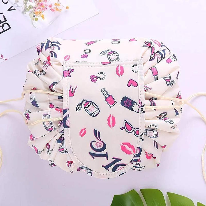 Detailed view of the interior of a lay-flat cosmetic bag, showcasing multiple compartments and a secure drawstring.