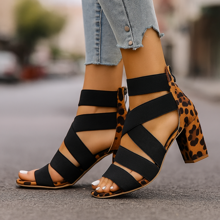 Women's leopard print block heel sandals with comfortable elastic wrap straps. Fashionable & chic.