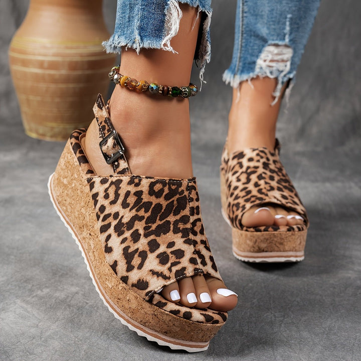 Women's leopard print platform wedge sandals with buckle strap, perfect for comfortable summer casual wear.