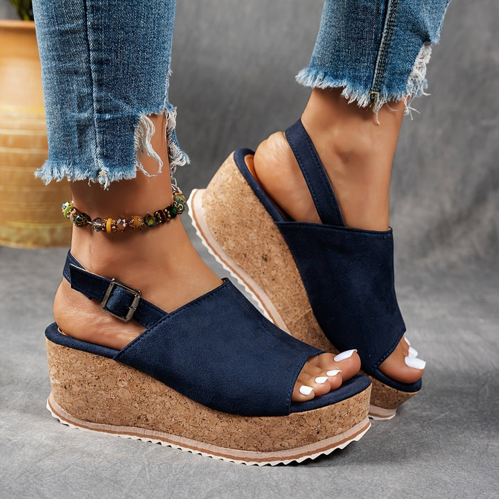 Leopard print platform wedge sandals for women, comfortable and fashionable, with secure buckle strap and open toe.