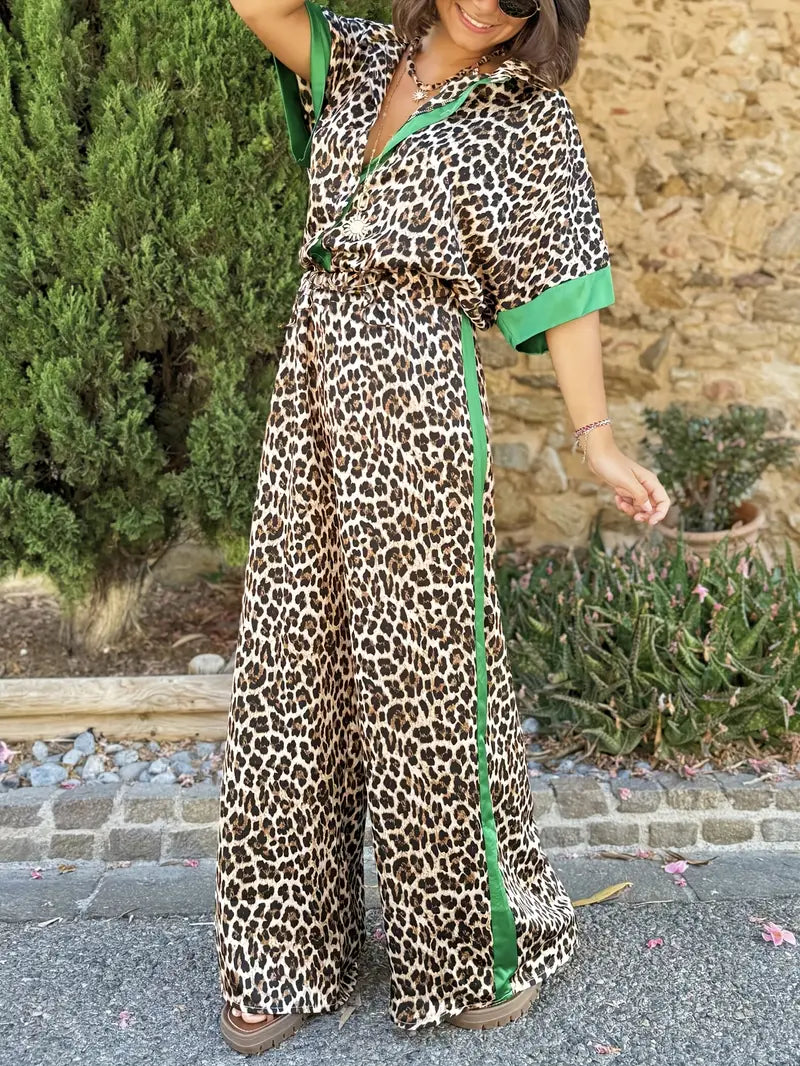 Elegant women's wide leg jumpsuit in leopard print with a flattering v-neck, suitable for any occasion.