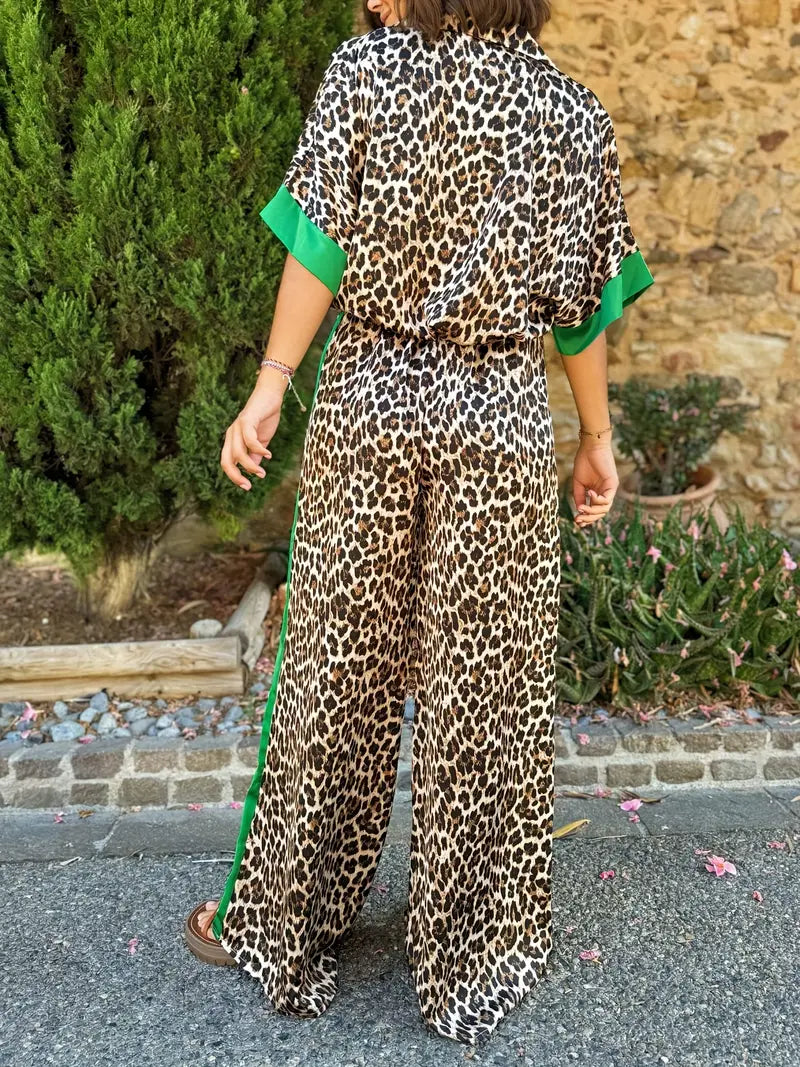 Trendy women's animal print wide leg jumpsuit with a deep v-neck. Comfortable & stylish one-piece fashion.