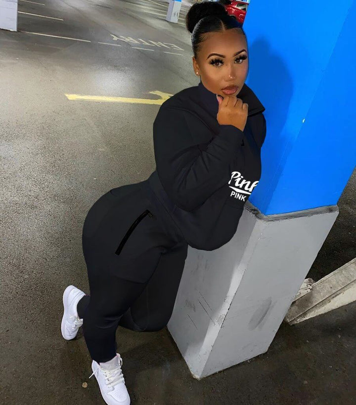Women's letter print sweatshirt and jogger pants two-piece matching set.