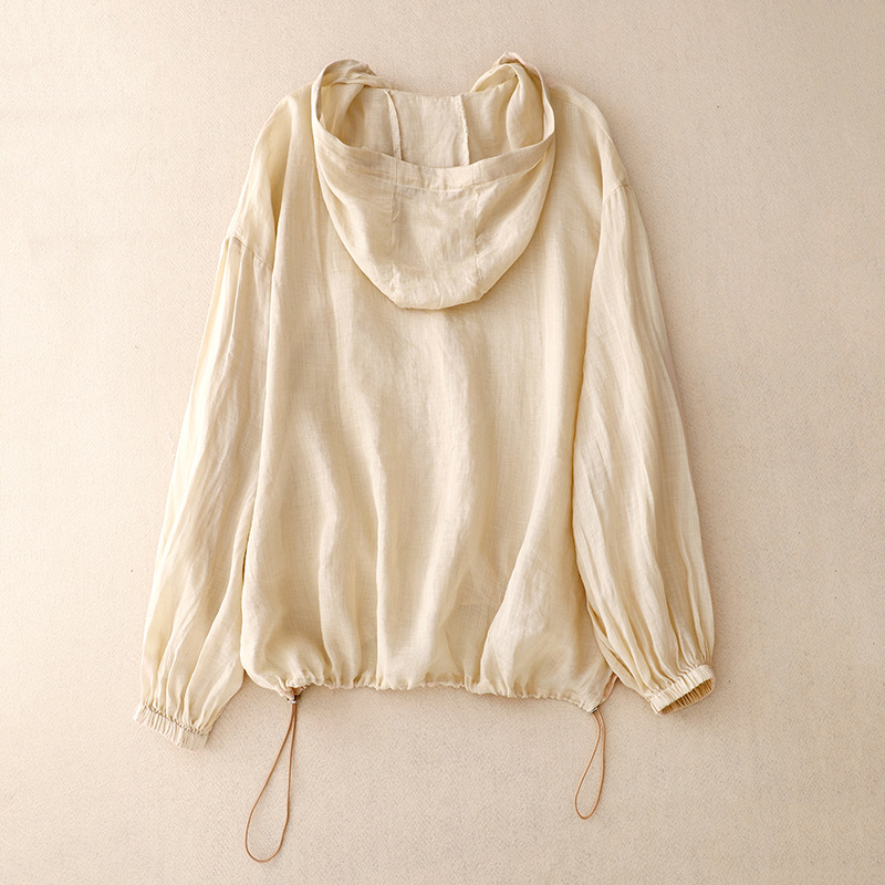 Stylish women's button-front hoodie with balloon sleeves, offering an airy, relaxed fit for versatile spring outfits.