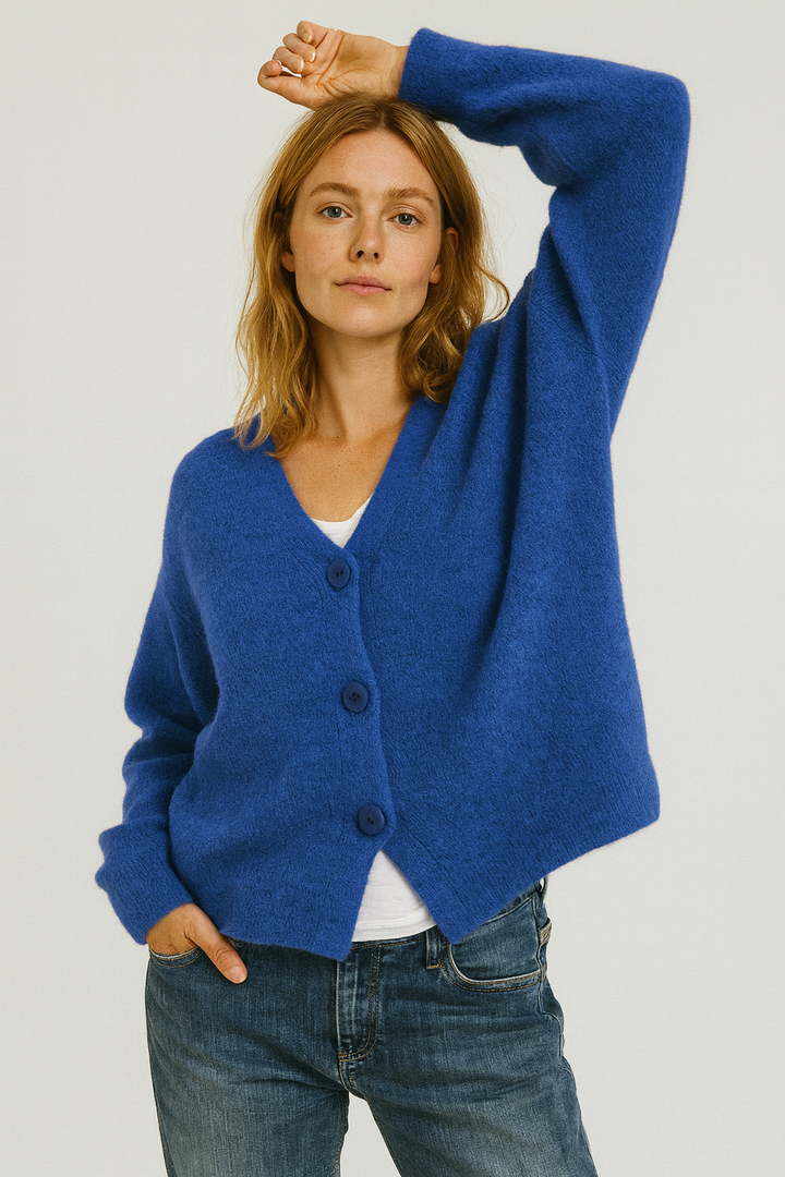 Casual women's short-sleeve button-front cardigan in soft pink, perfect for spring and summer outfits.